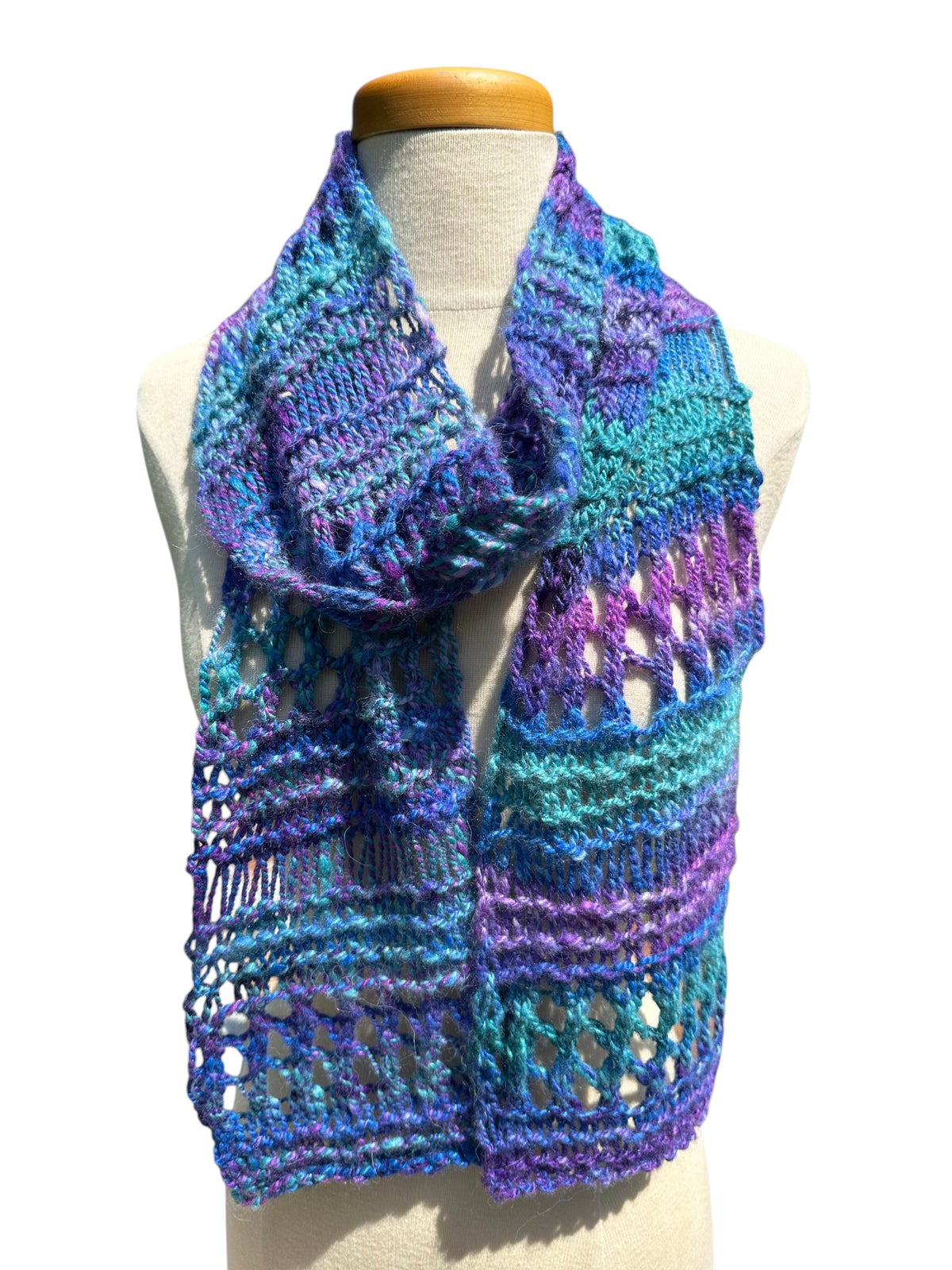 Oak Crest Alpacas and More hand-knit chunky alpaca scarf in purple and green lace design on a mannequin