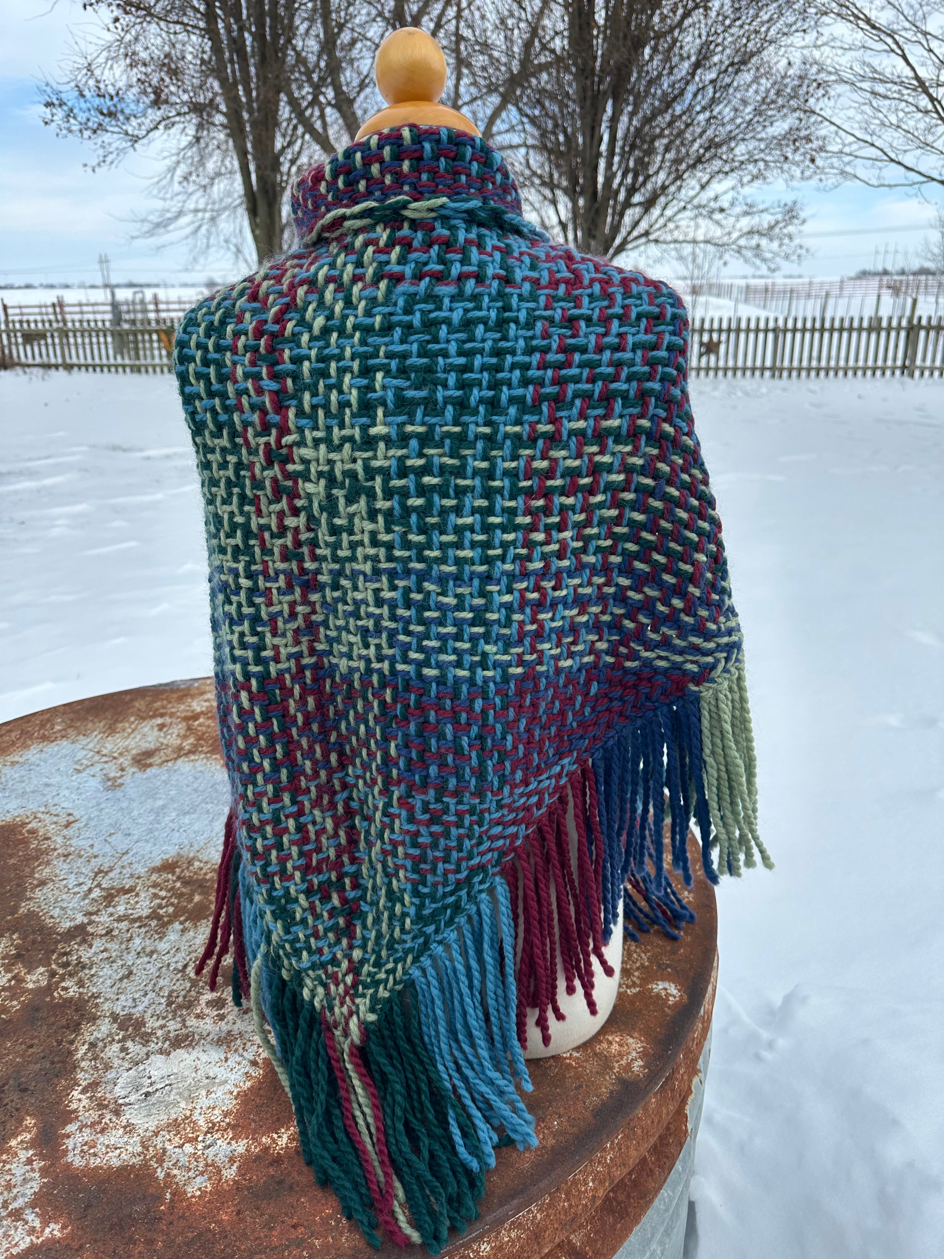 100% Alpaca hand woven shawl with fringe. Very soft and warm.