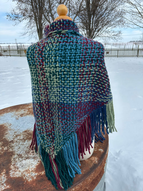 100% Alpaca hand woven shawl with fringe. Very soft and warm.