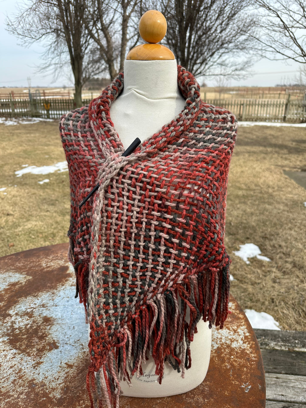100% Alpaca hand woven shawl with fringe. Very soft and warm.