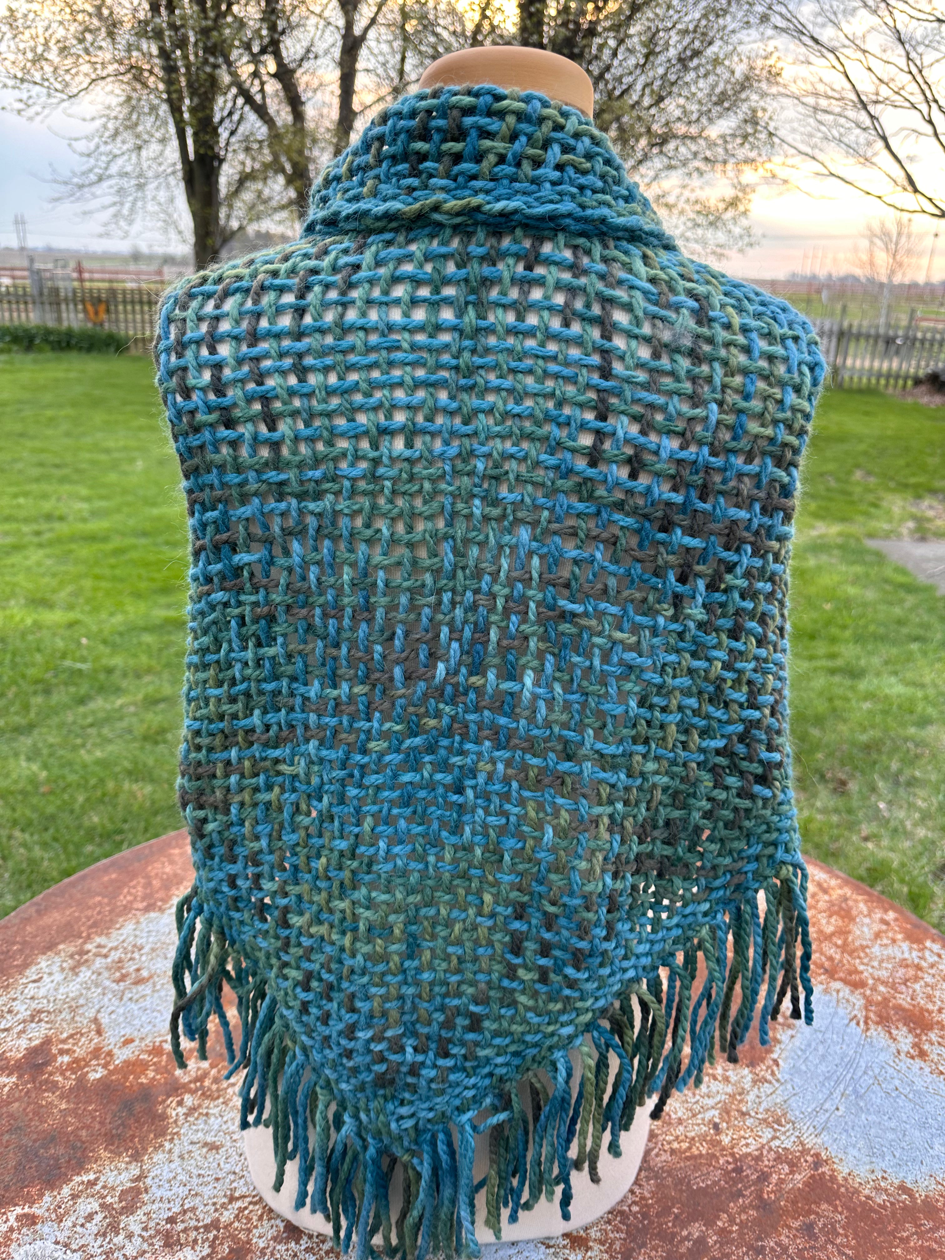 100% Alpaca hand woven shawl with fringe. Very soft and warm.