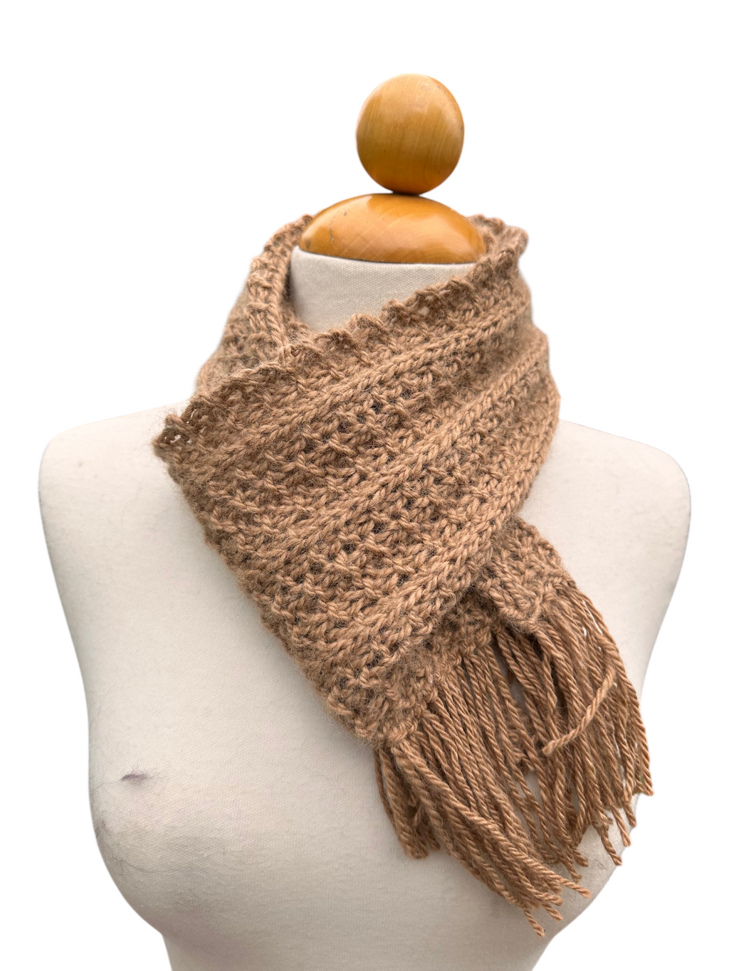 Oak Crest Alpacas and More hand knit tan alpaca wool scarf with fringe on a mannequin