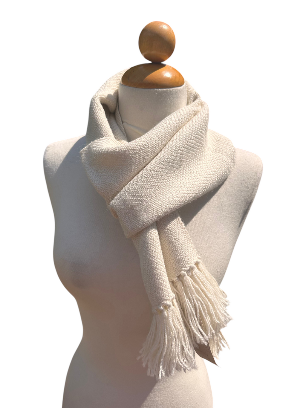 Oak Crest Alpacas and More white woven baby alpaca scarf with fringe on a mannequin outdoors
