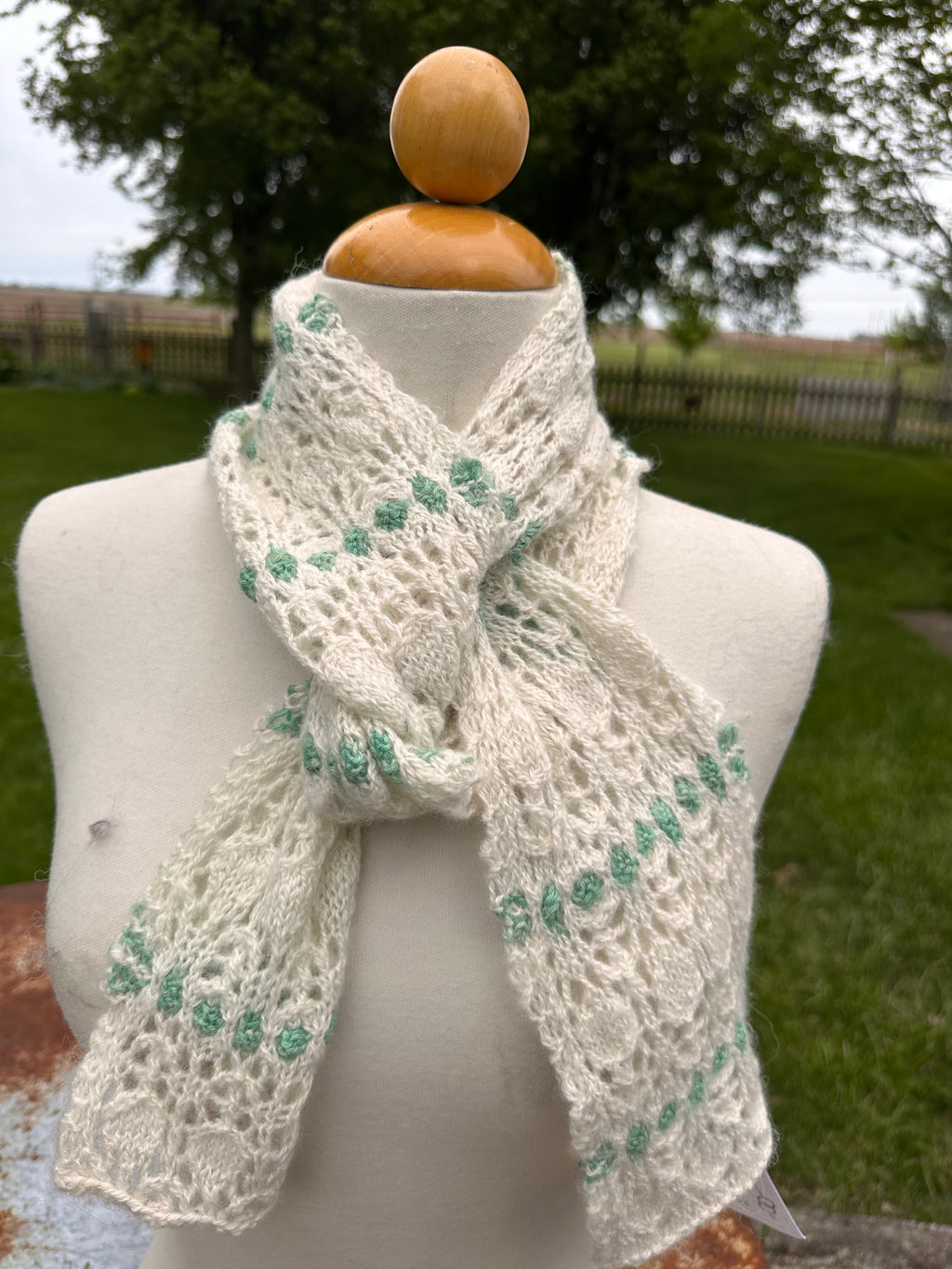 100% USA Alpaca hand knit scarf. Delicate lacey pattern.