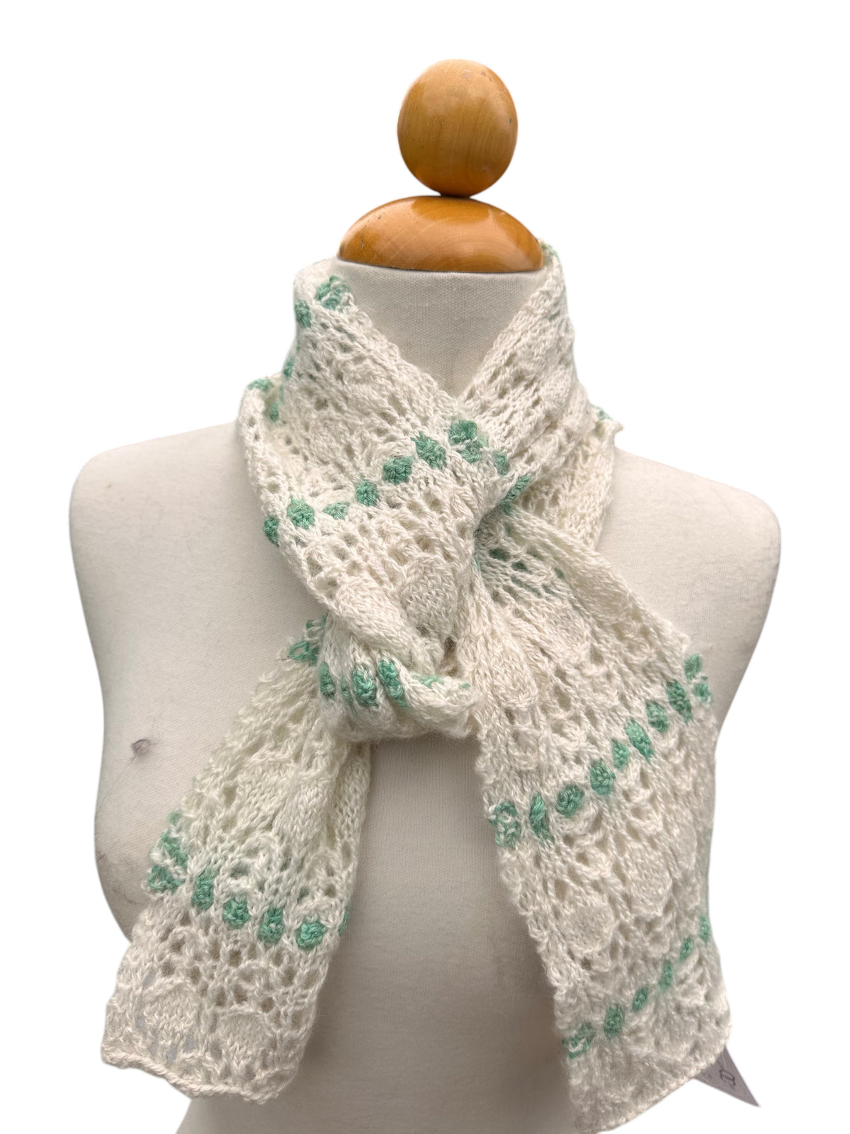 Oak Crest Alpacas and More hand knit white and green lace alpaca scarf on a mannequin