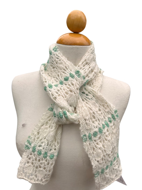 Oak Crest Alpacas and More hand knit white and green lace alpaca scarf on a mannequin