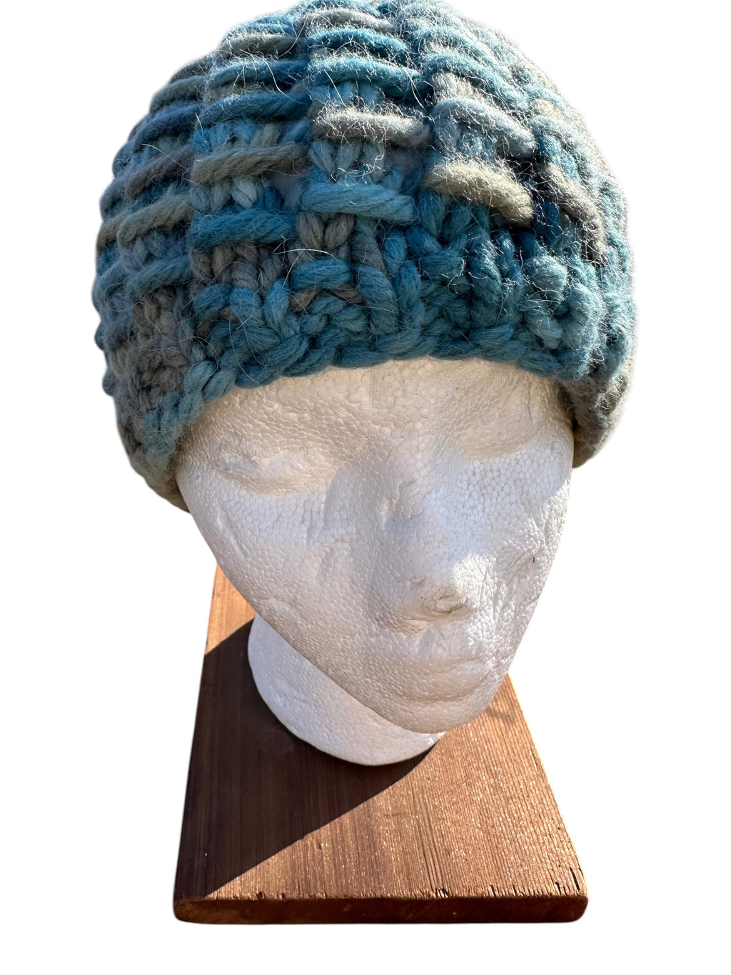 Oak Crest Alpacas and More chunky knit variegated teal alpaca and wool beanie hat on a mannequin head