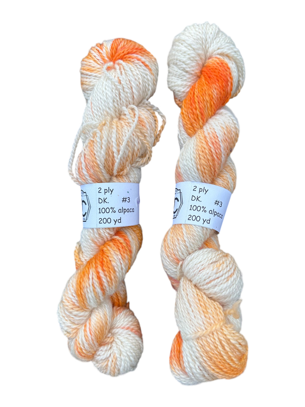 Oak Crest Alpacas and More hand-dyed 100% alpaca DK weight yarn in a white and orange variegated 2-ply skein.