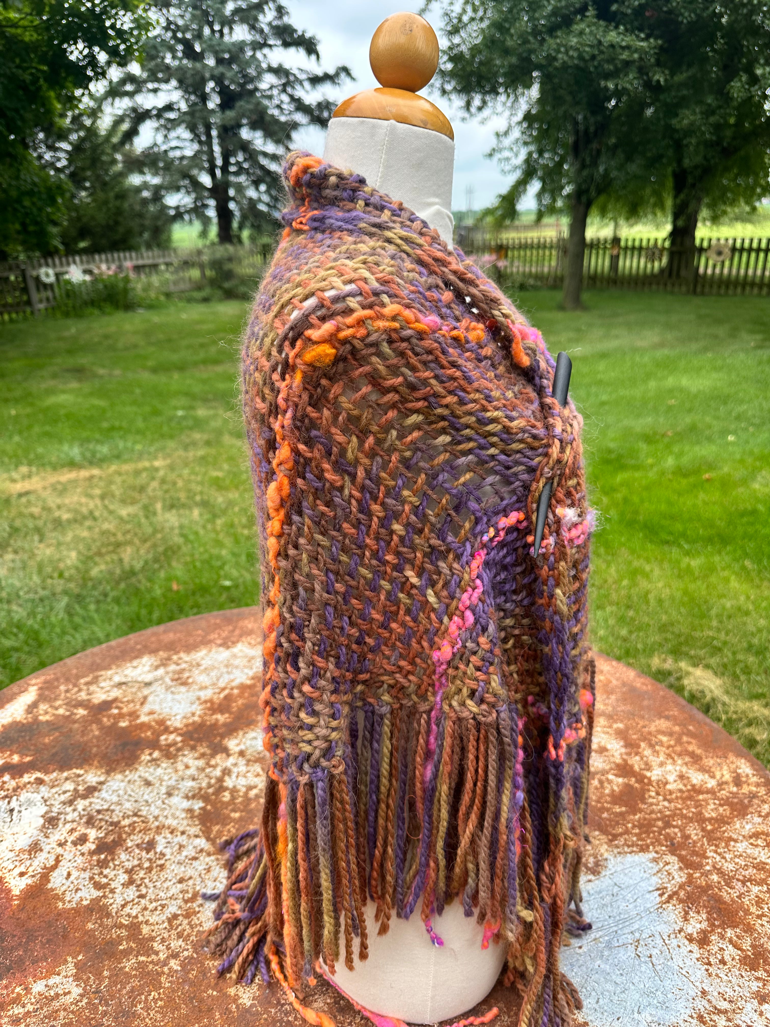 100% Alpaca hand woven shawl with fringe. Very soft and warm.