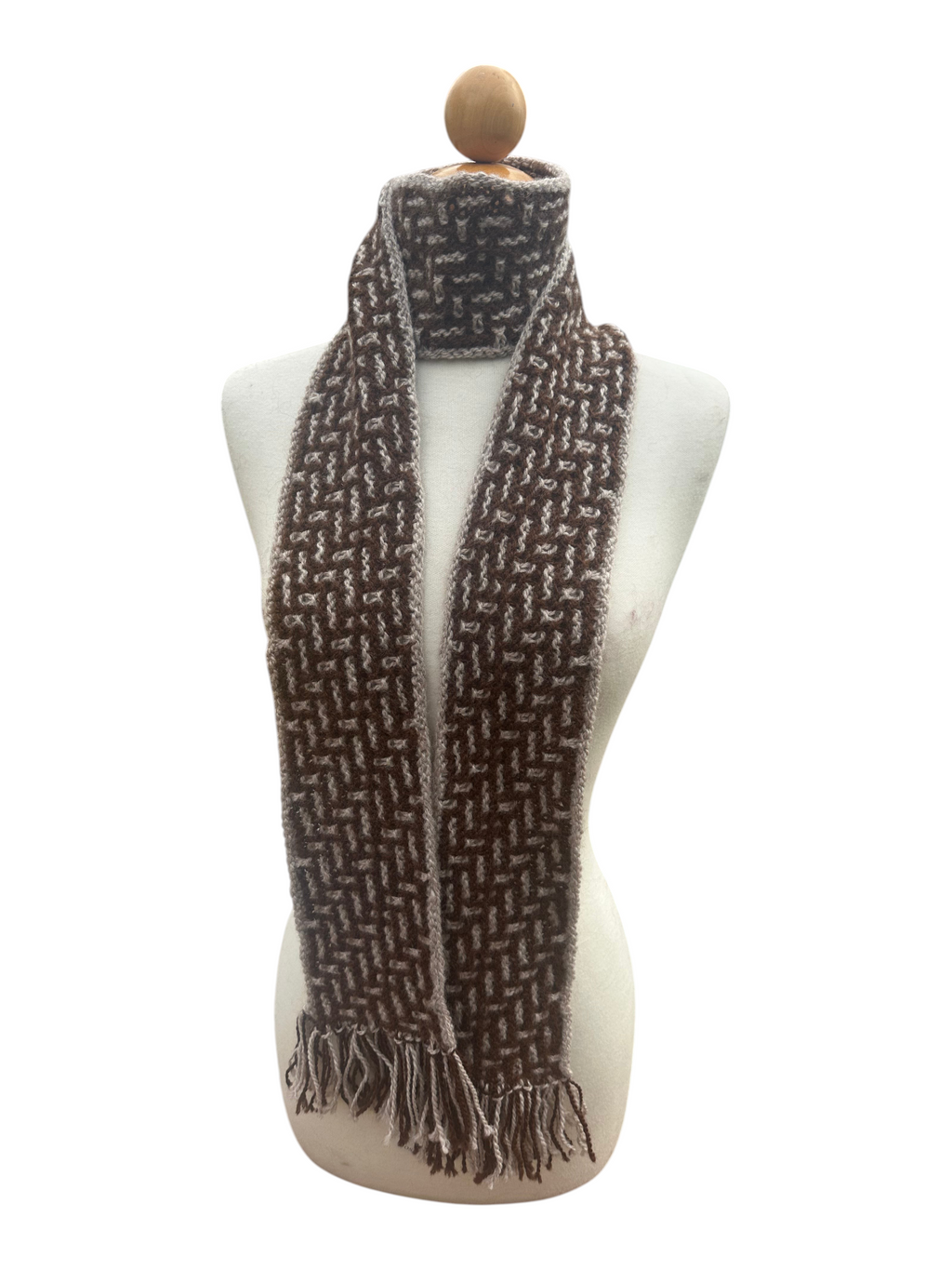 Oak Crest Alpacas and More hand knit brown and cream alpaca wool scarf with fringe on a mannequin