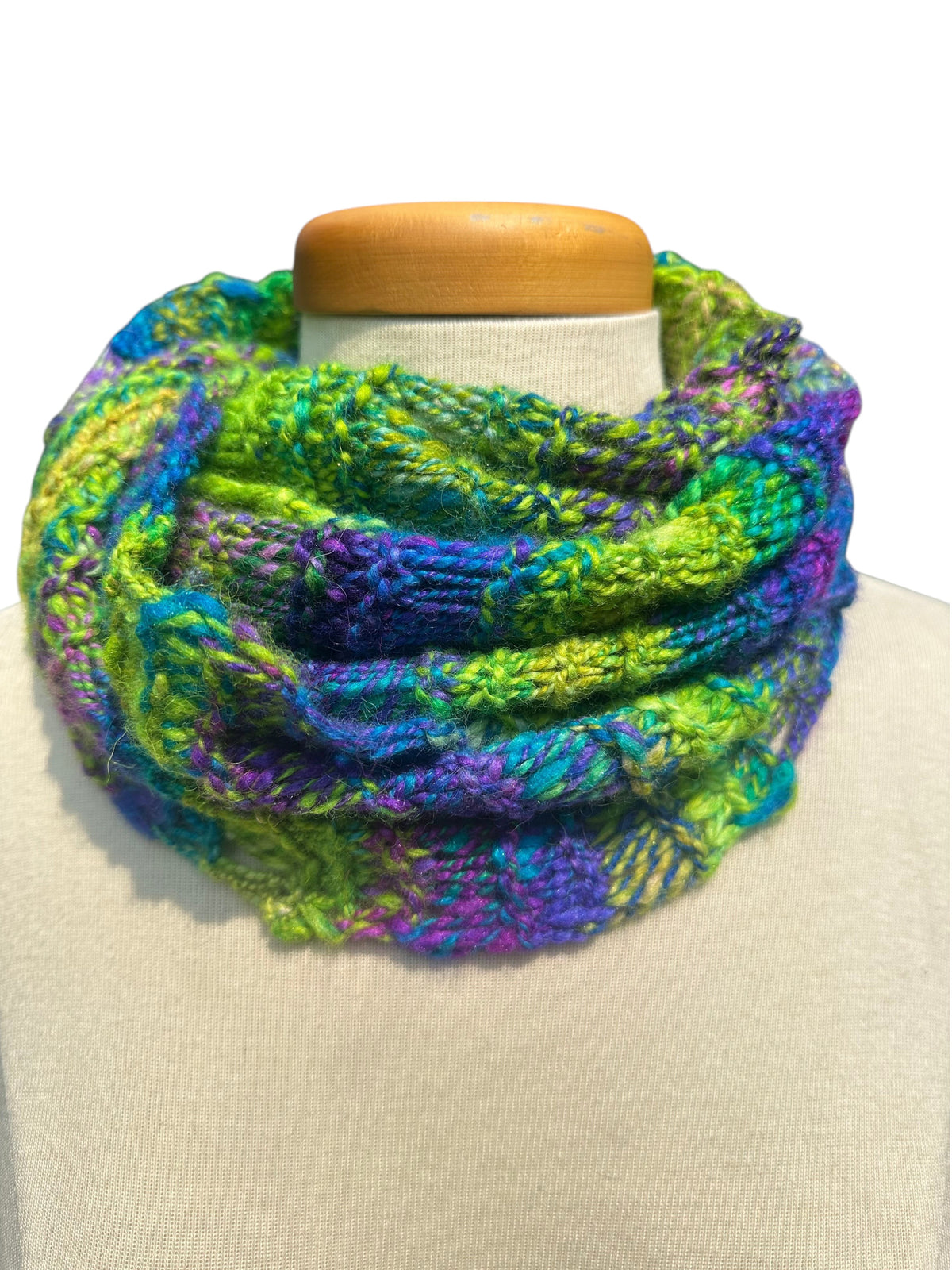 Oak Crest Alpacas and More hand-knit chunky alpaca scarf in vibrant purple and green lace design on a mannequin