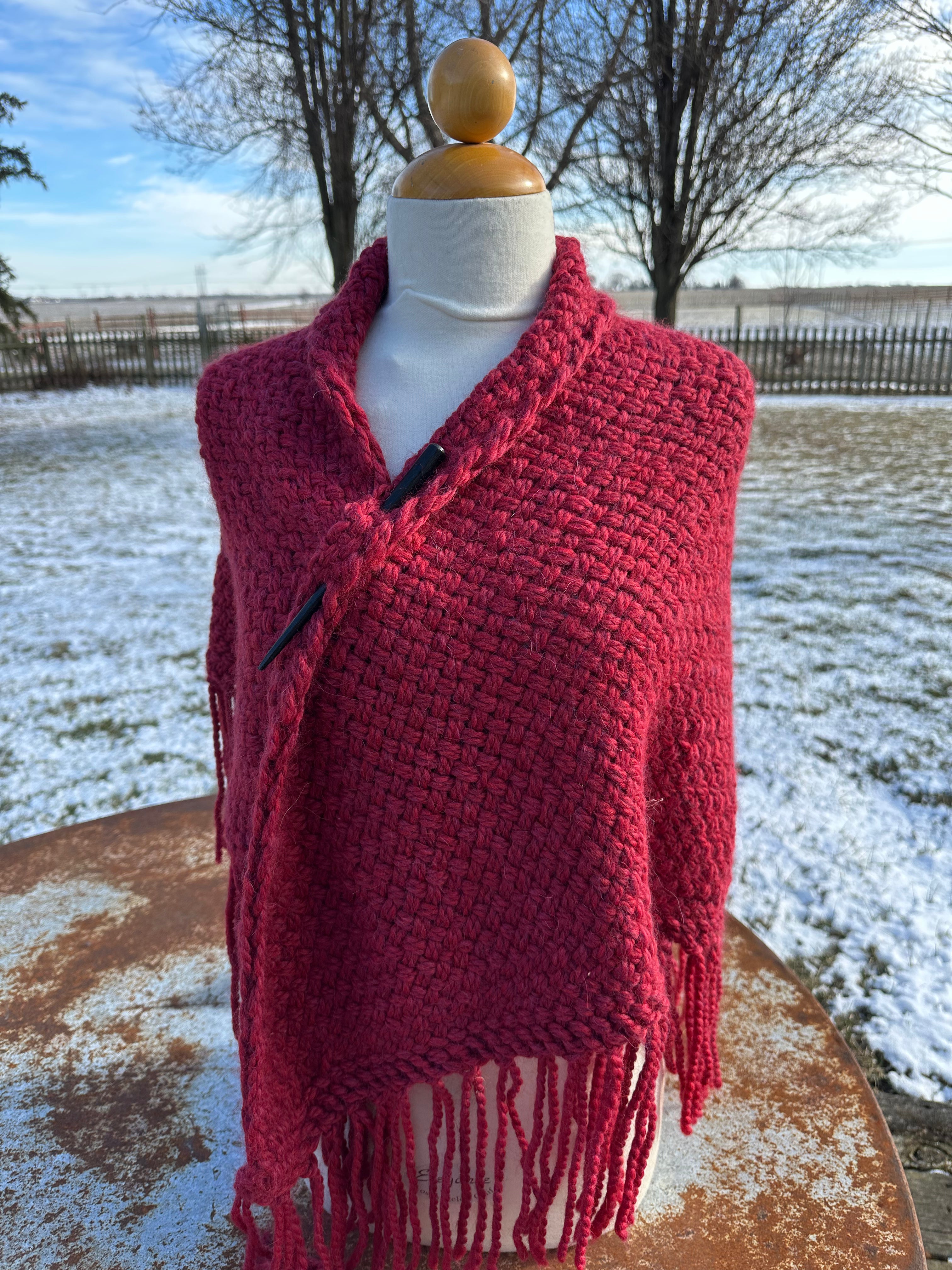100% Alpaca hand woven shawl with fringe. Very soft and warm.