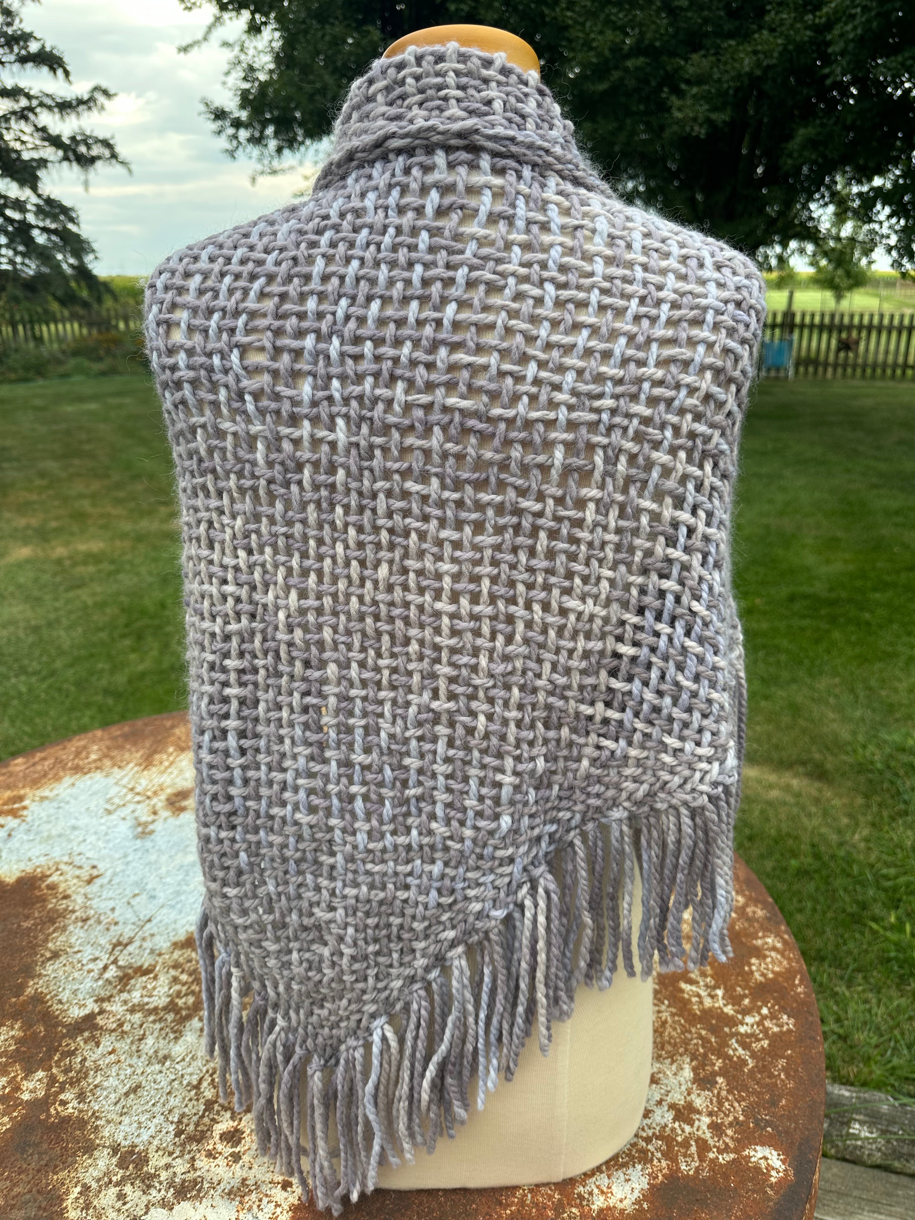 100% Alpaca hand woven shawl with fringe. Very soft and warm.