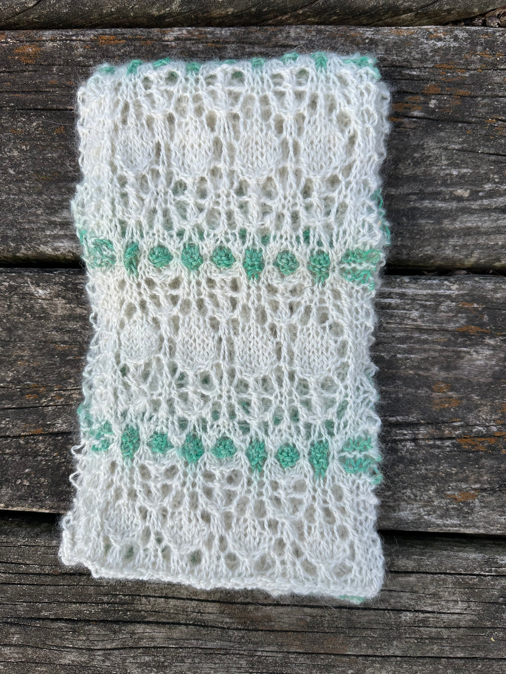 100% USA Alpaca hand knit scarf. Delicate lacey pattern.