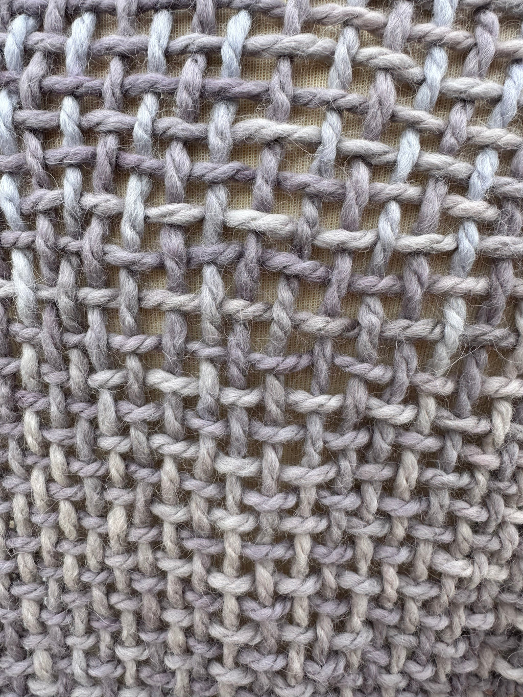 100% Alpaca hand woven shawl with fringe. Very soft and warm.