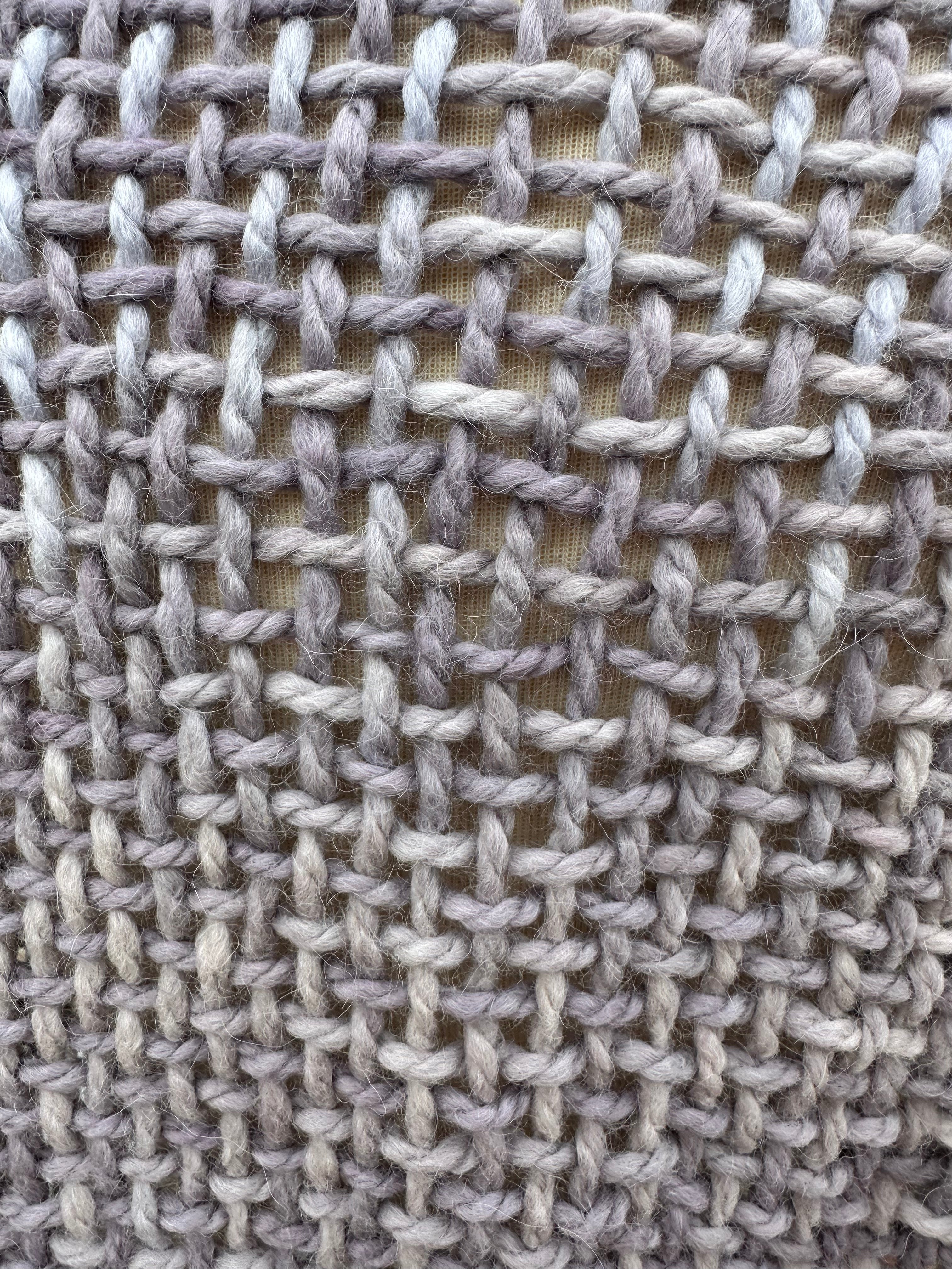 100% Alpaca hand woven shawl with fringe. Very soft and warm.