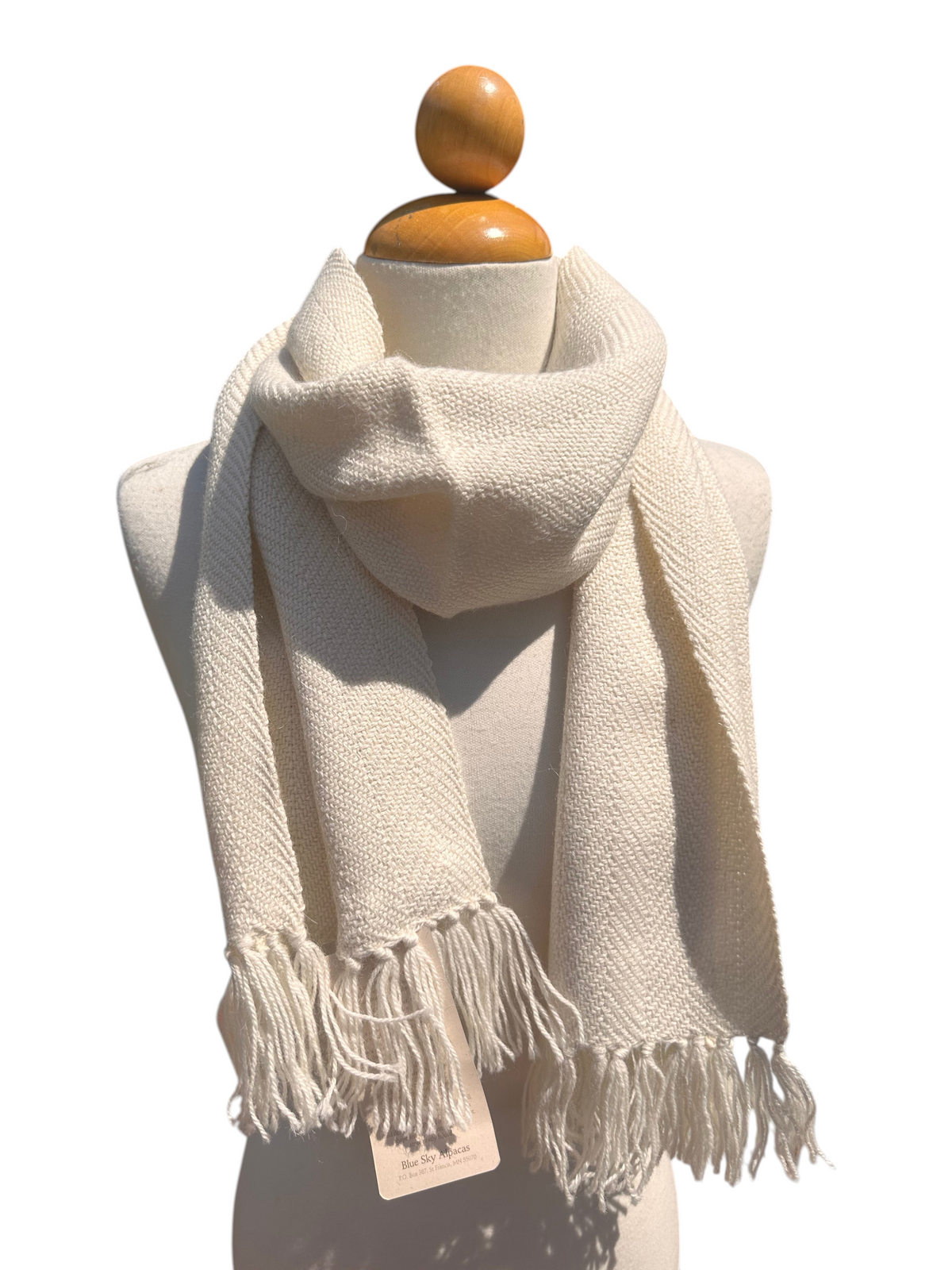 Oak Crest Alpacas and More white woven baby alpaca scarf with fringe detail on a mannequin