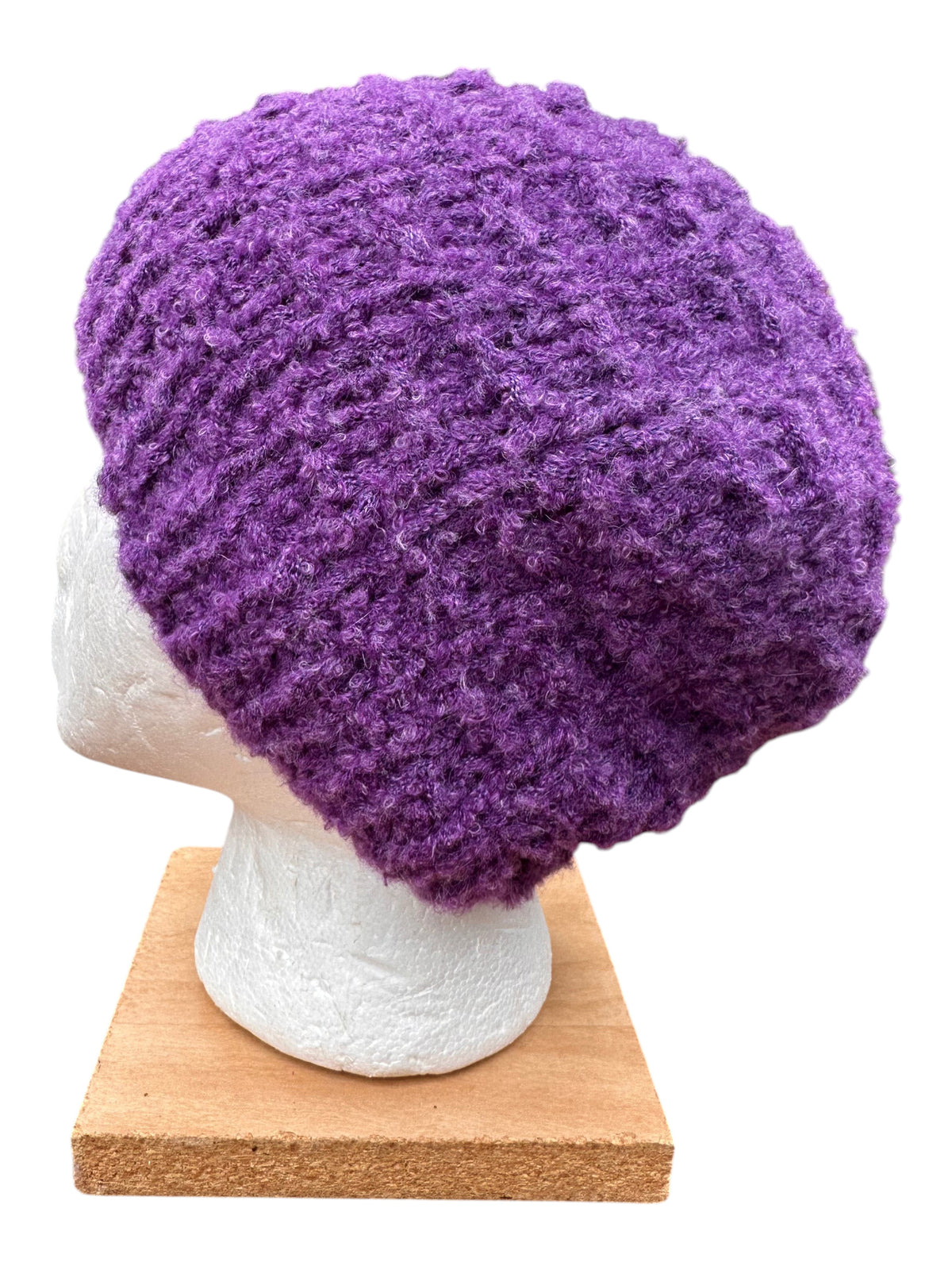 Oak Crest Alpacas and More hand-knit purple boucle alpaca blend textured hat on a mannequin head