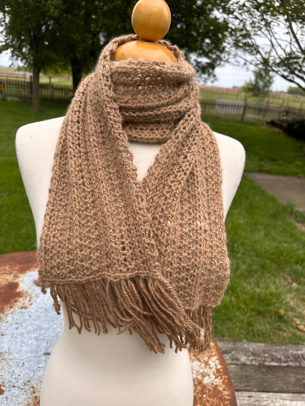 100% USA Alpaca hand knit scarf. Very soft and warm.