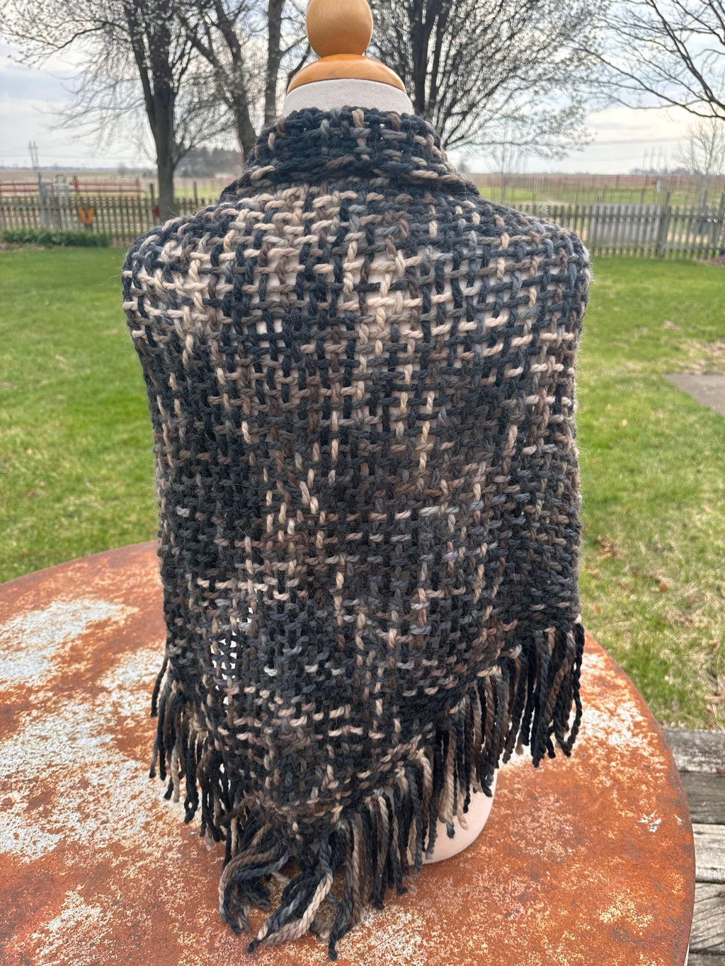 100% Alpaca hand woven shawl with fringe. Very soft and warm.