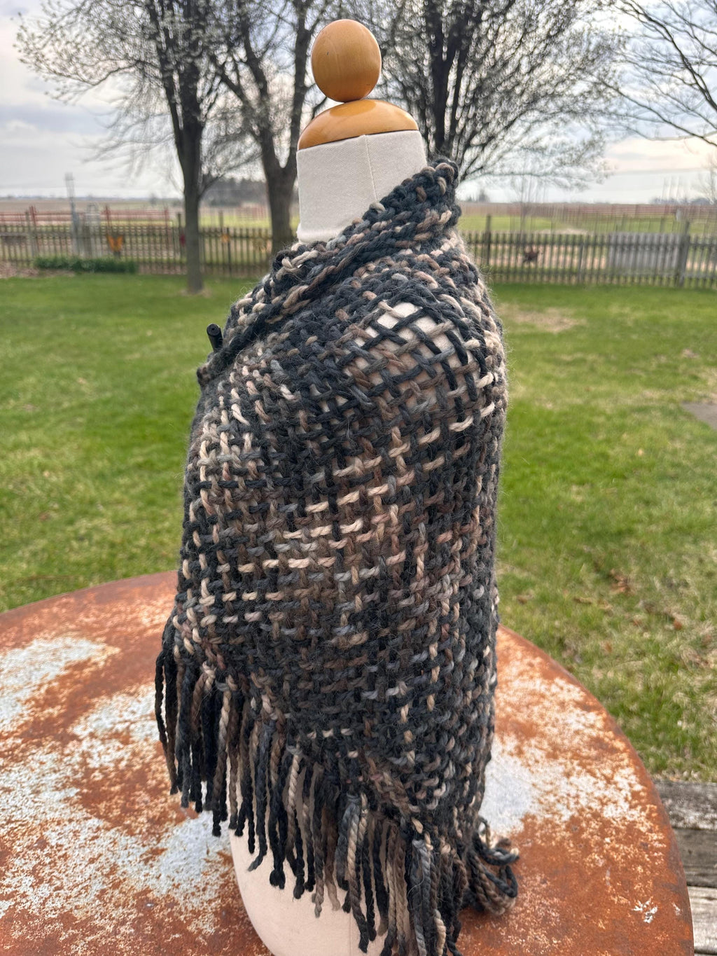 100% Alpaca hand woven shawl with fringe. Very soft and warm.