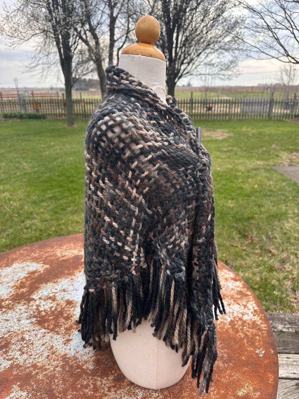 100% Alpaca hand woven shawl with fringe. Very soft and warm.