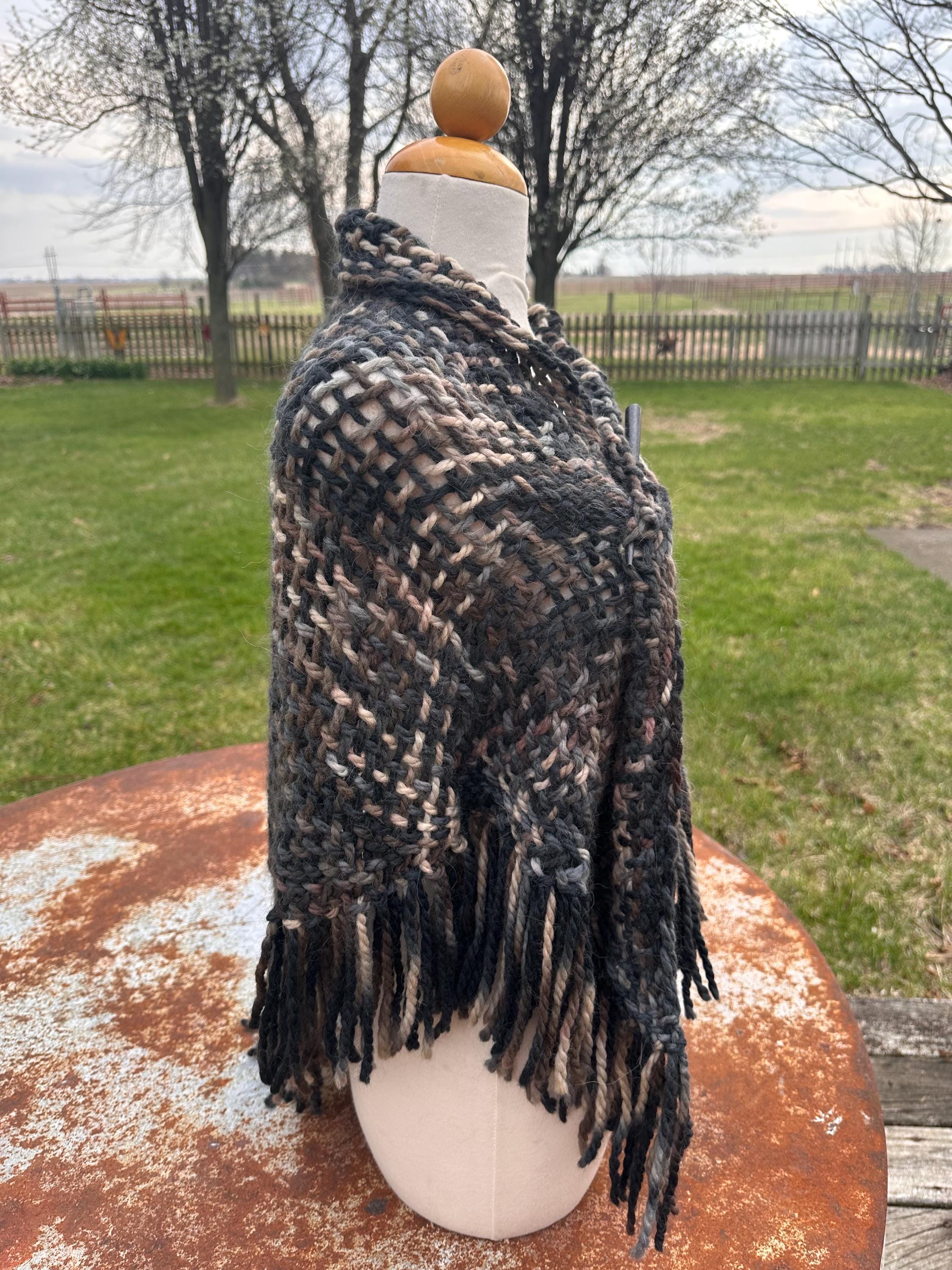 100% Alpaca hand woven shawl with fringe. Very soft and warm.