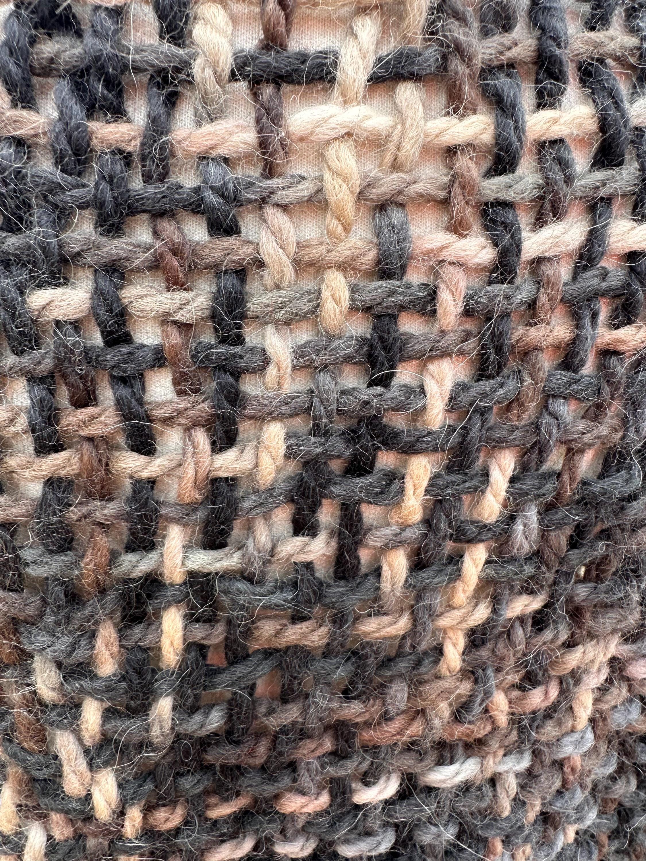 100% Alpaca hand woven shawl with fringe. Very soft and warm.