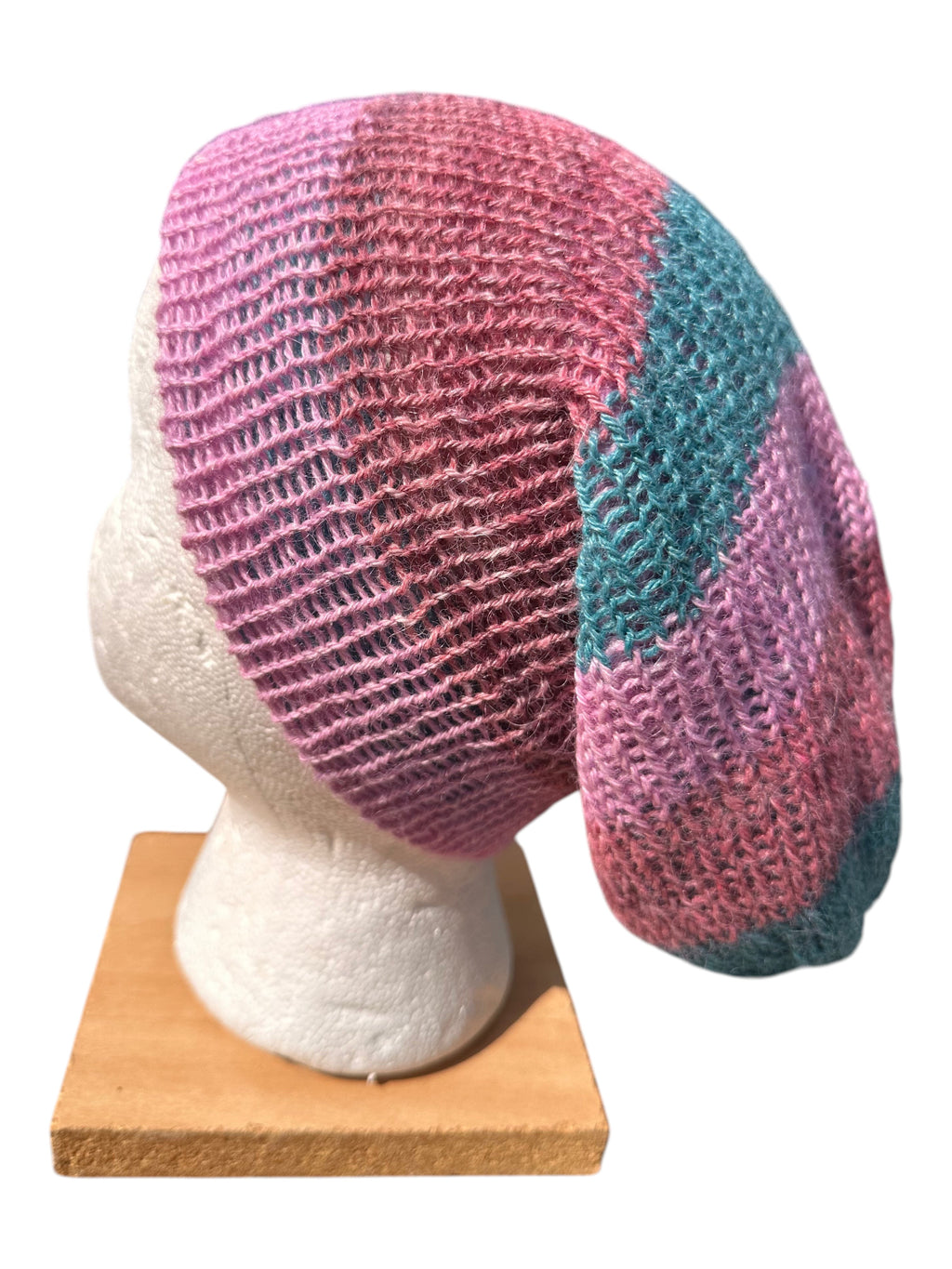 Oak Crest Alpacas and More lightweight double knit alpaca hat in pink and teal, shown on a mannequin head.