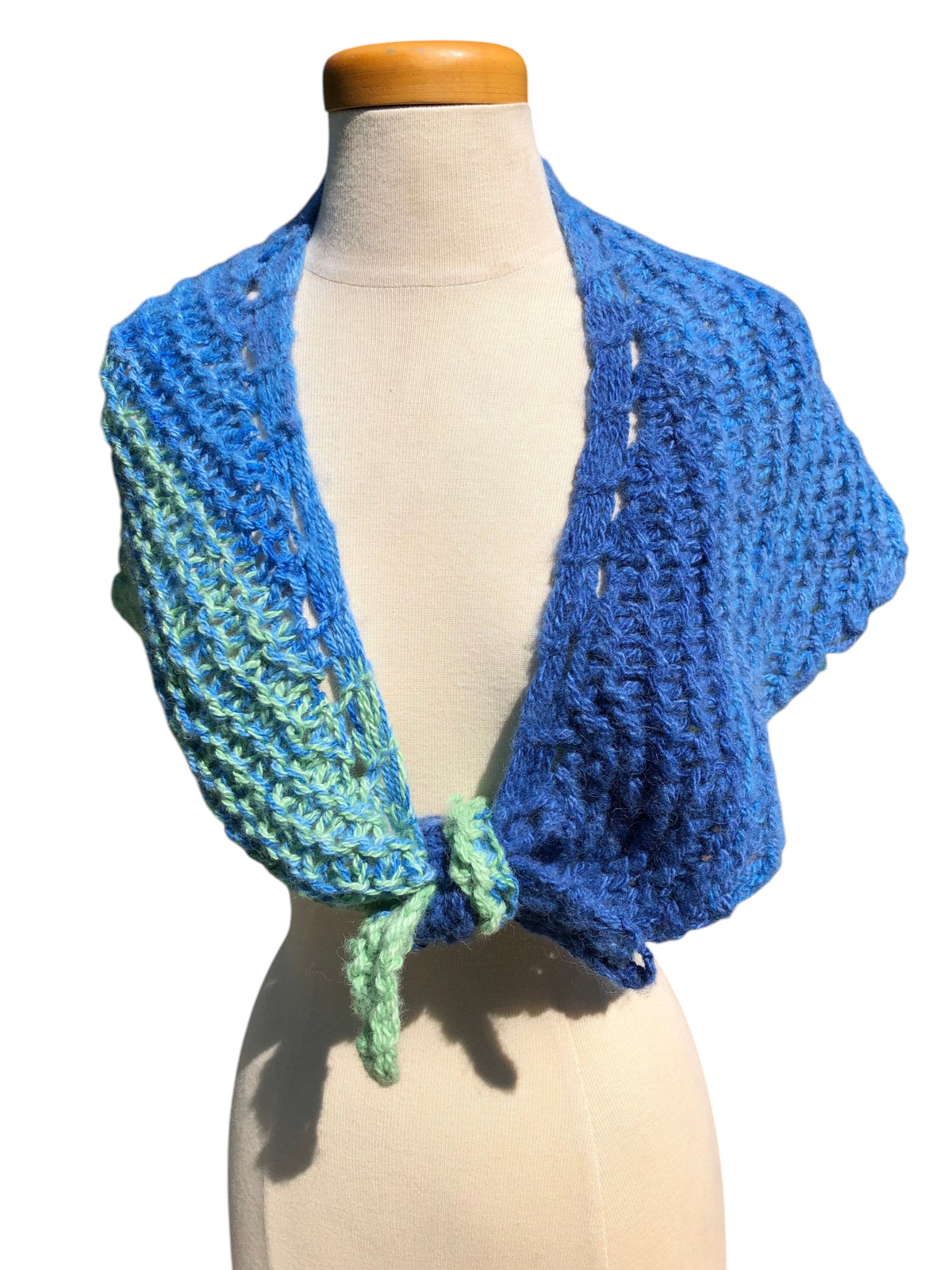 Oak Crest Alpacas and More hand knit alpaca shawl in bright blue and green gradient on a mannequin