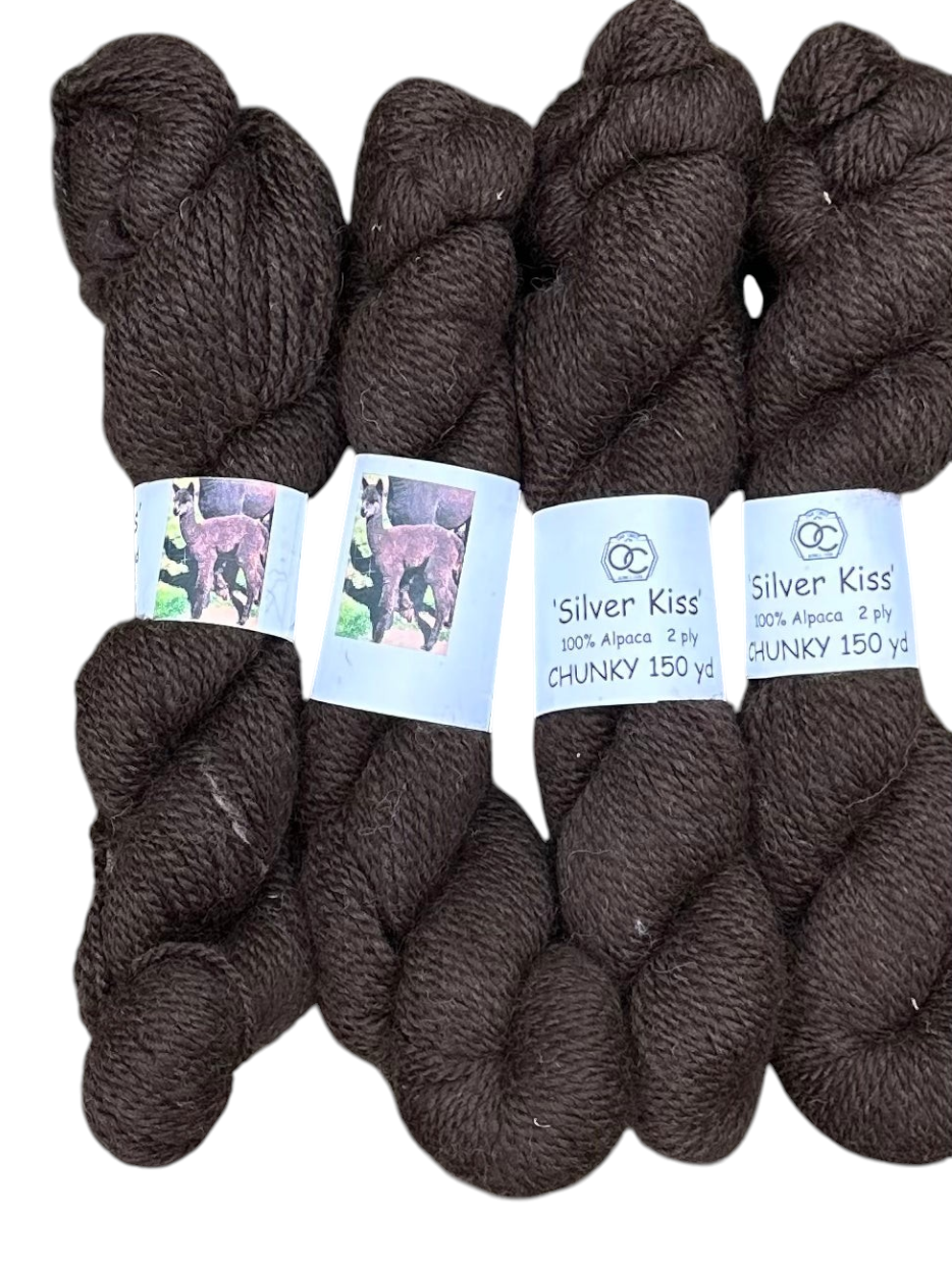 Oak Crest Alpacas and More chunky 2-ply bay black alpaca yarn skeins with Silver Kiss labels