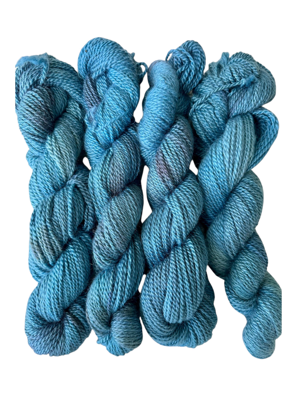 Oak Crest Alpacas and More hand-dyed blue worsted weight 2-ply alpaca yarn skeins with soft dehaired texture.