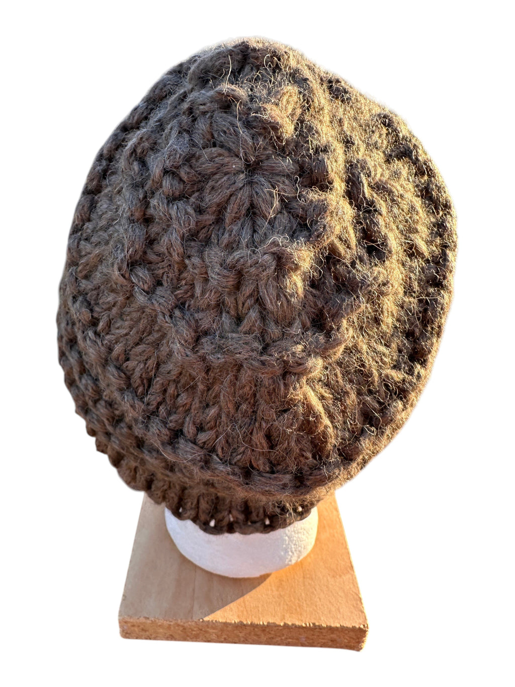 Oak Crest Alpacas and More hand-knit chunky brown alpaca wool hat with a textured lace pattern on a display stand.