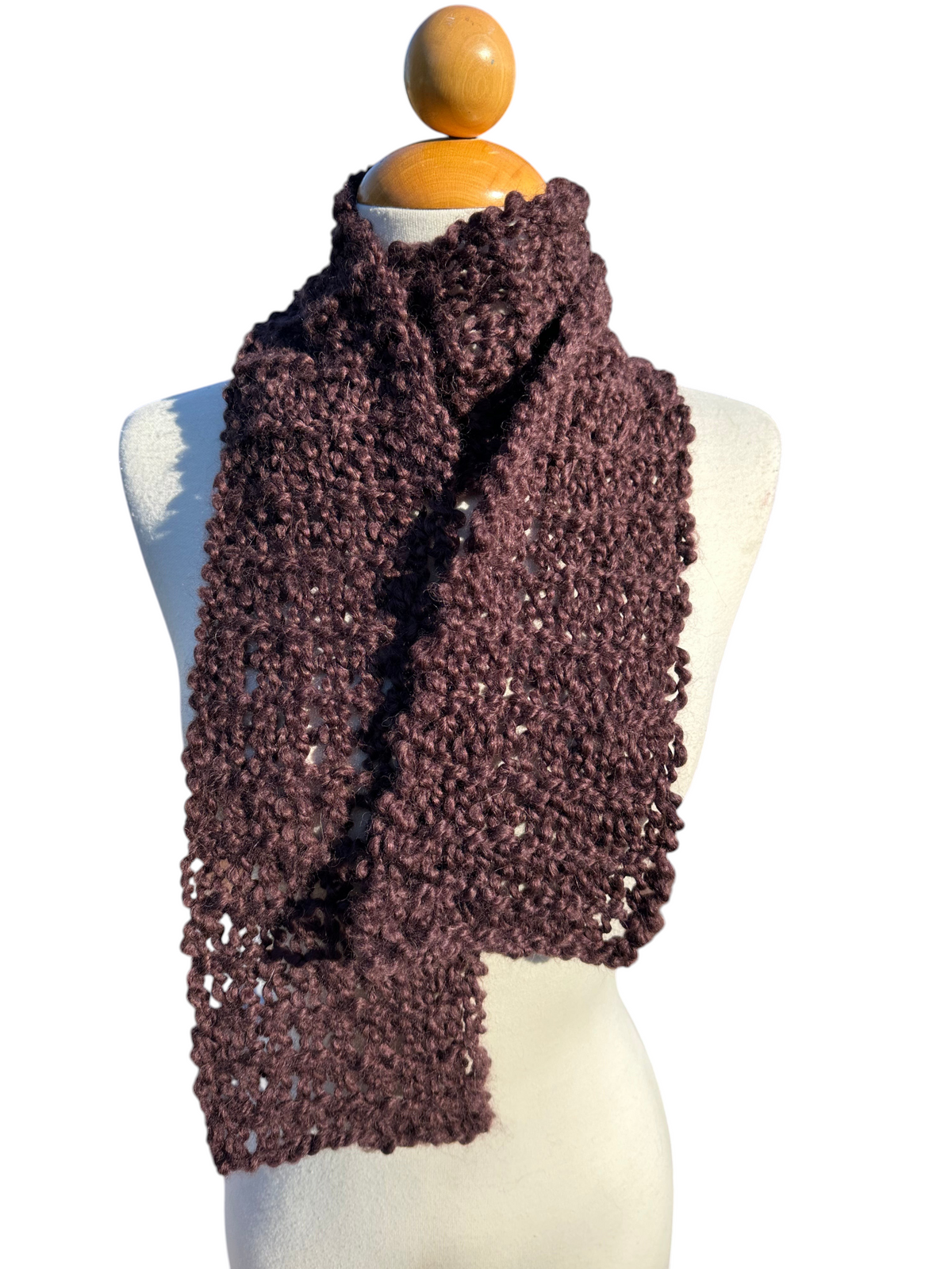 Oak Crest Alpacas and More hand-knit chocolate brown boucle alpaca and wool scarf on a mannequin