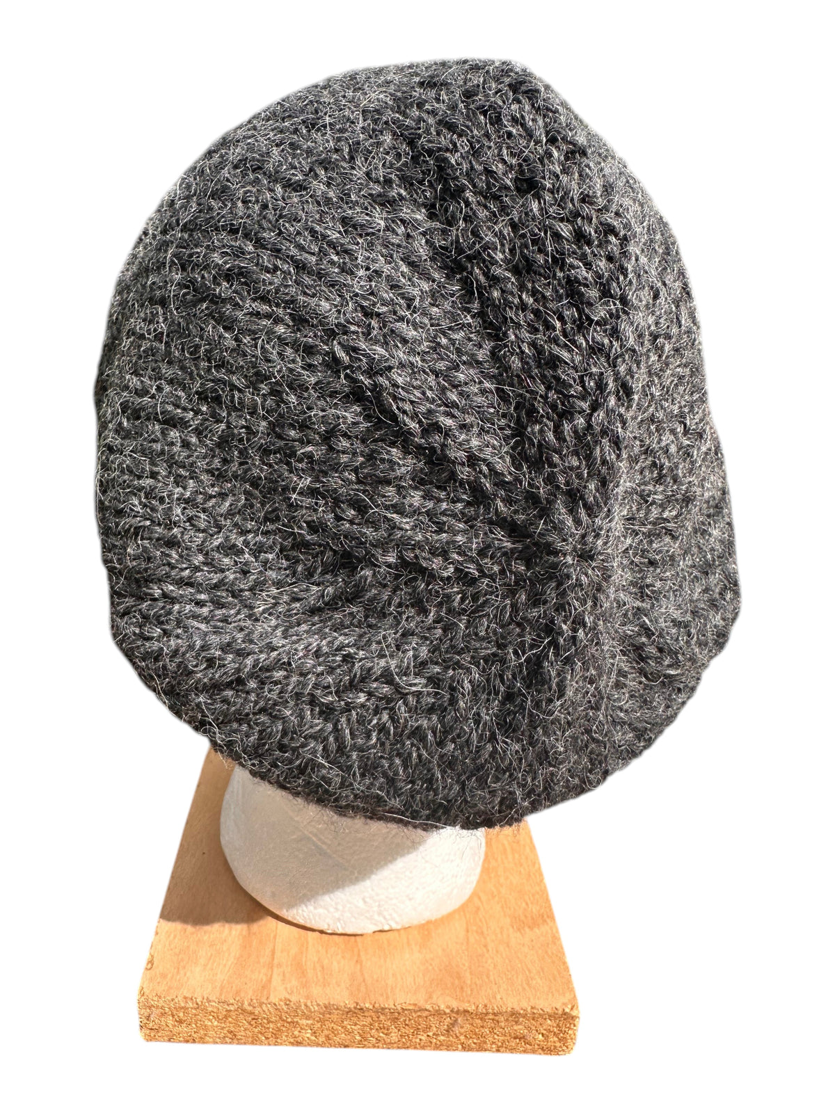 Oak Crest Alpacas and More charcoal gray hand-knit chunky alpaca and wool winter beanie on a display head