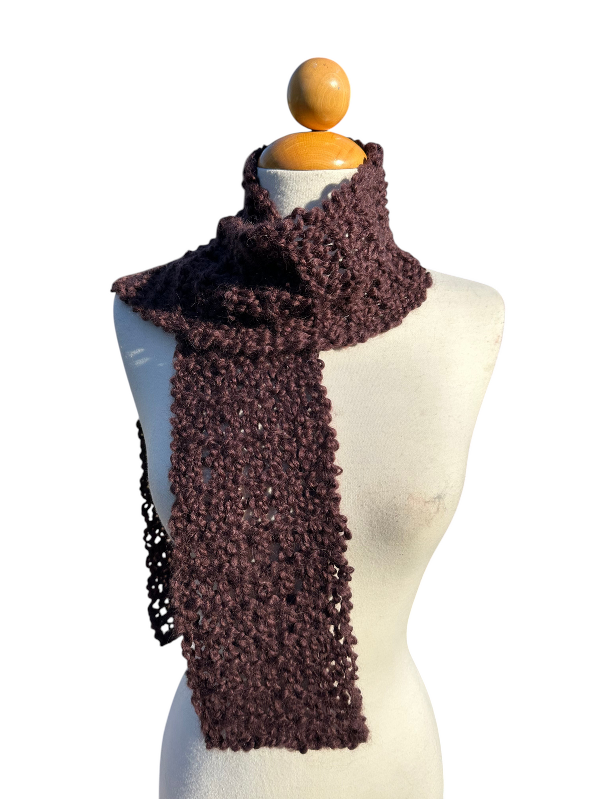 Oak Crest Alpacas and More hand-knit chocolate brown alpaca and wool boucle scarf on a mannequin