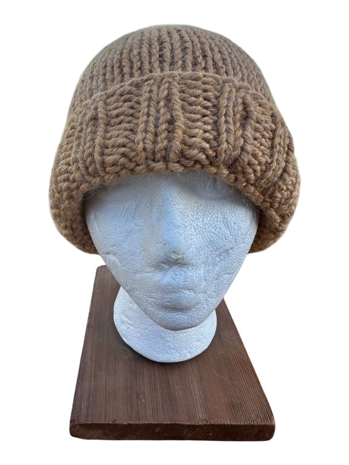 Oak Crest Alpacas and More chunky wheat-colored hand-knit alpaca wool beanie with a folded brim on a mannequin head.