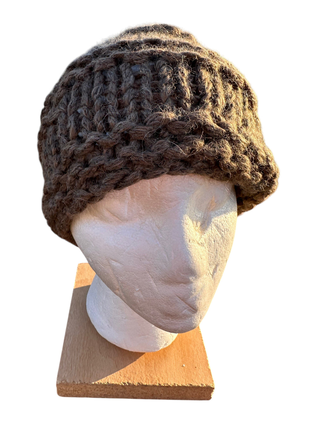 Oak Crest Alpacas and More hand-knit chunky brown alpaca wool hat with a textured lace pattern on a display head.
