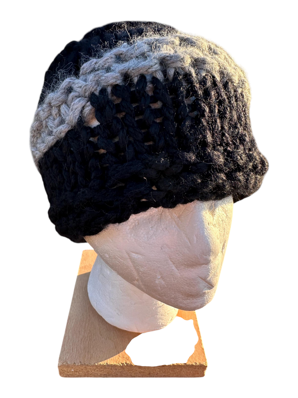 Oak Crest Alpacas and More hand-knit chunky alpaca hat in black and grey with a lacey pattern on a mannequin head.