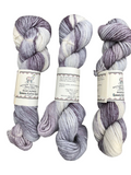 Oak Crest Alpacas and More chunky 3-ply yarn in variegated purple and white alpaca and merino wool blend
