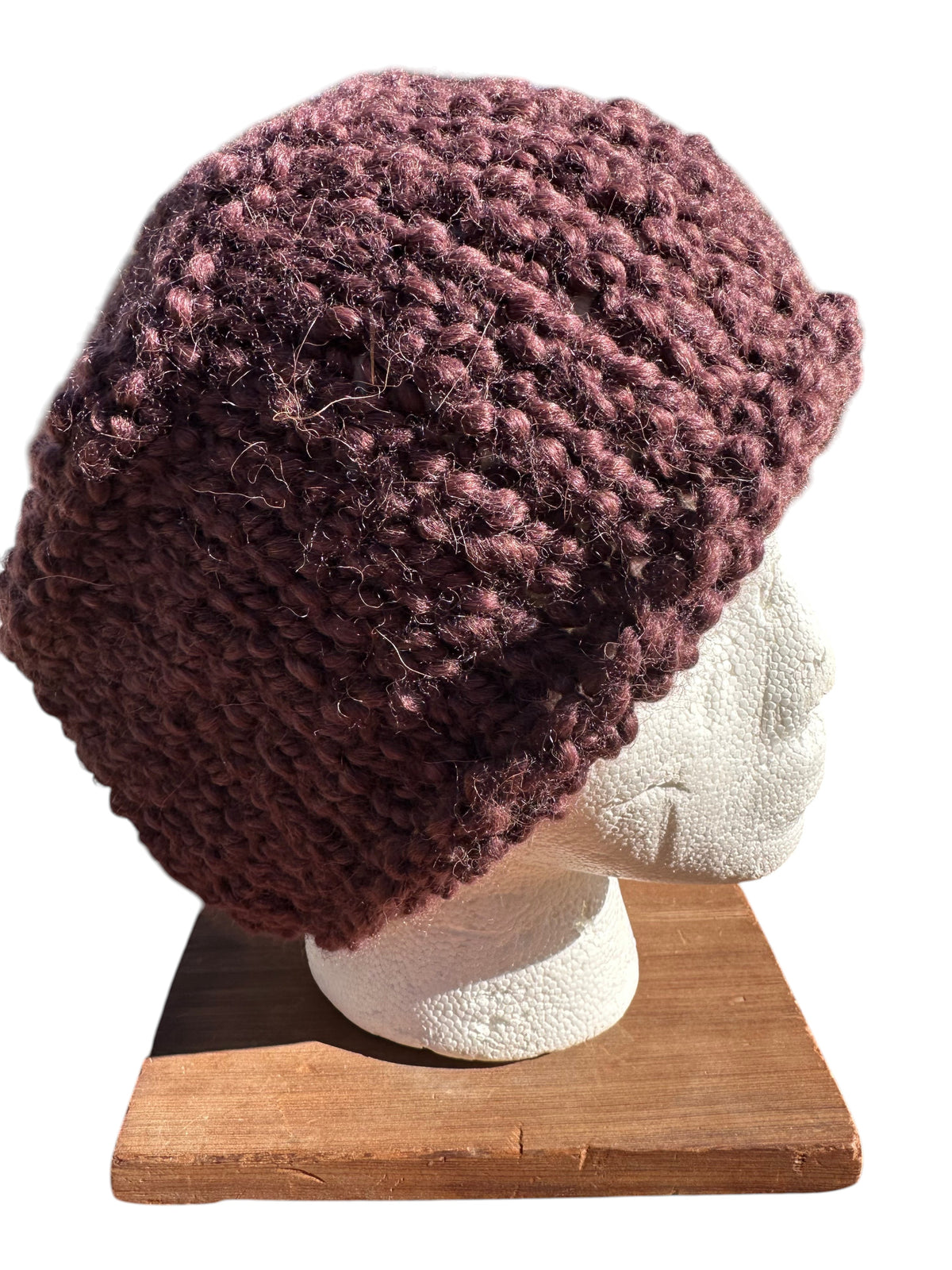 Oak Crest Alpacas and More hand-knit chunky boucle hat in chocolate brown with purple tones on a mannequin head