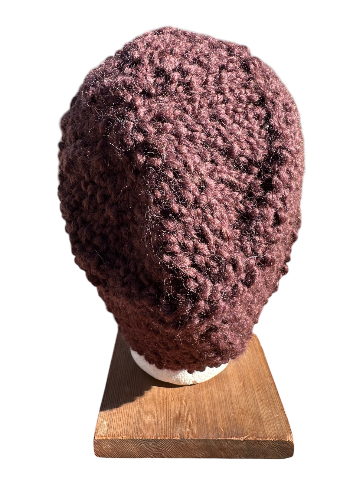 Oak Crest Alpacas and More hand-knit chunky boucle hat in chocolate brown with deep purple tones.