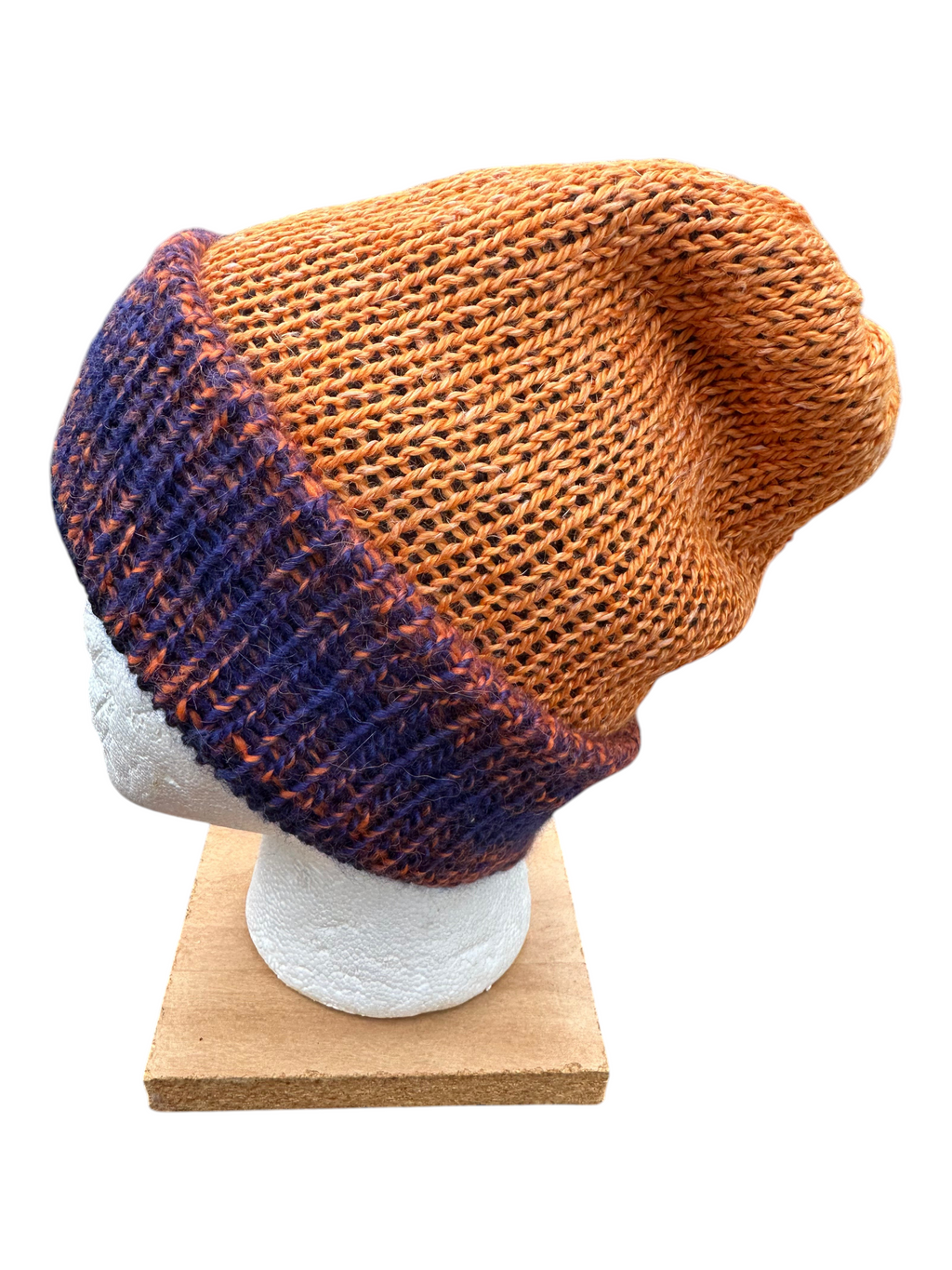 Oak Crest Alpacas and More double knit alpaca hat in orange and blue with a fold over brim on a mannequin head