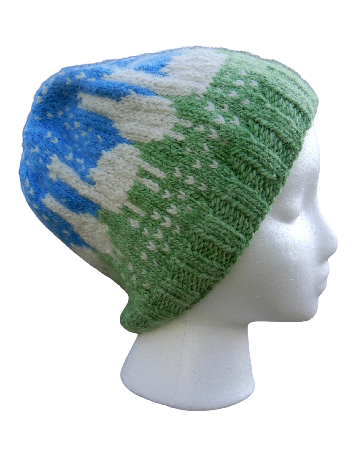 Oak Crest Alpacas and More Fair Isle alpaca wool hat in blue, green, and white on a white mannequin head