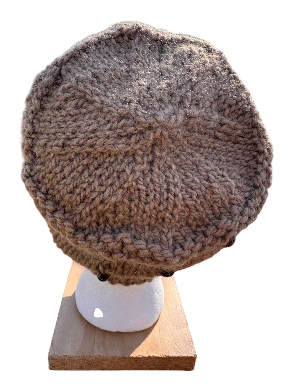 Oak Crest Alpacas and More hand-knit fawn alpaca hat with decorative beads on a display head