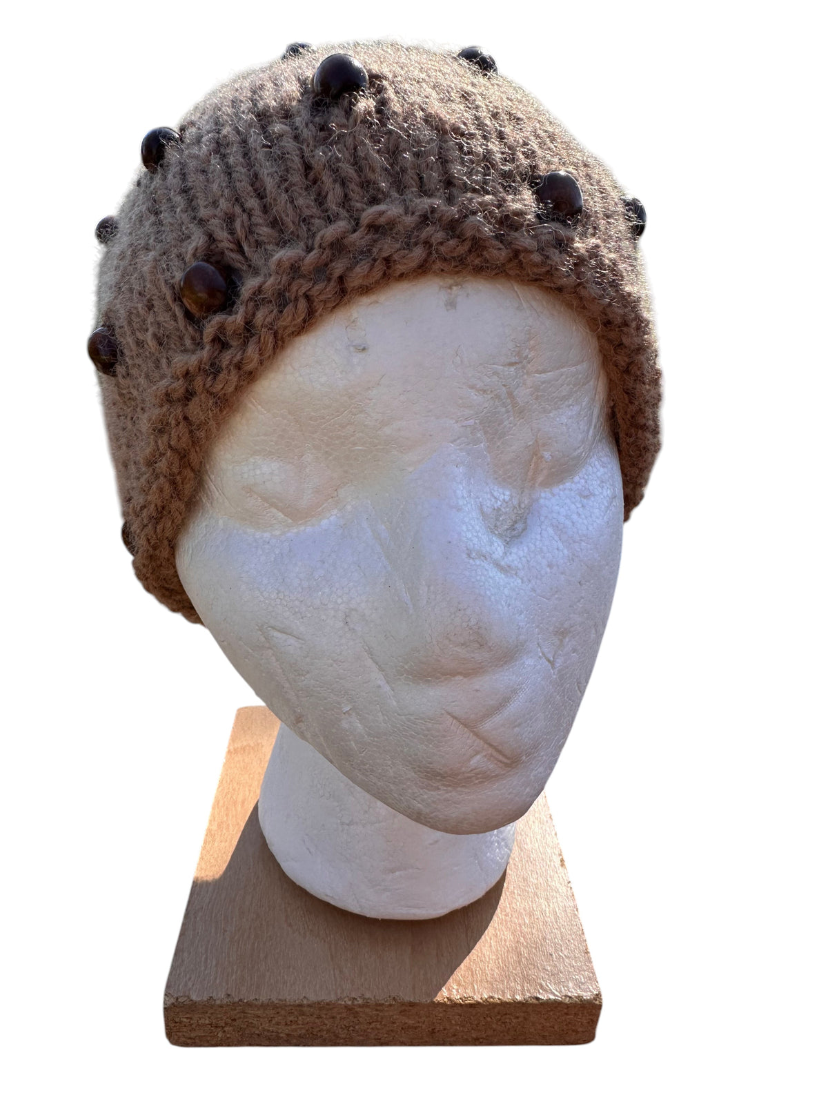 Oak Crest Alpacas and More hand-knit fawn alpaca wool hat with decorative beads on a mannequin head