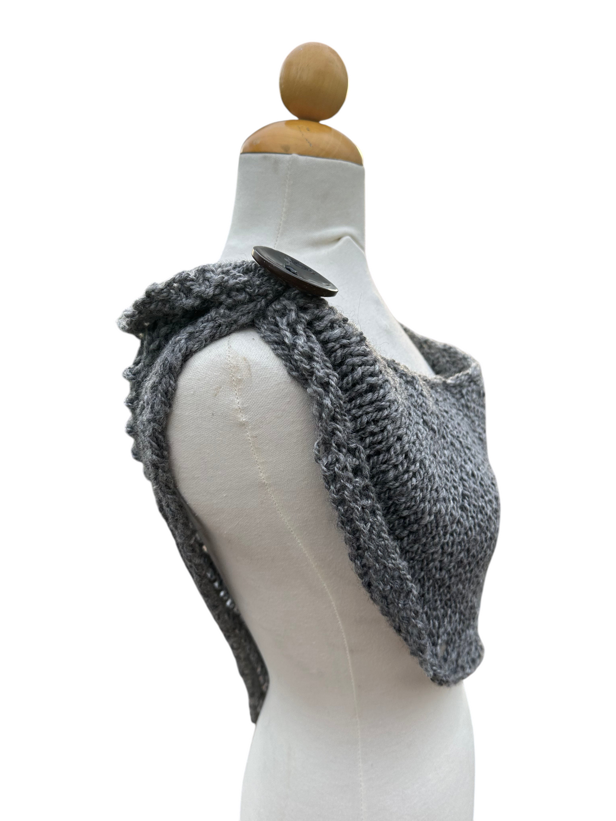 Oak Crest Alpacas and More grey hand knit 100% alpaca shawl with a decorative button cuff on a mannequin