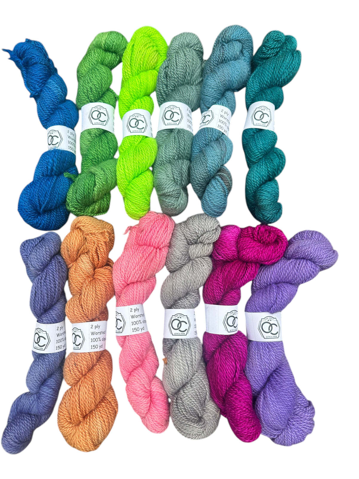 Oak Crest Alpacas and More hand-dyed 100% alpaca worsted weight yarn skeins in a variety of vibrant colors.