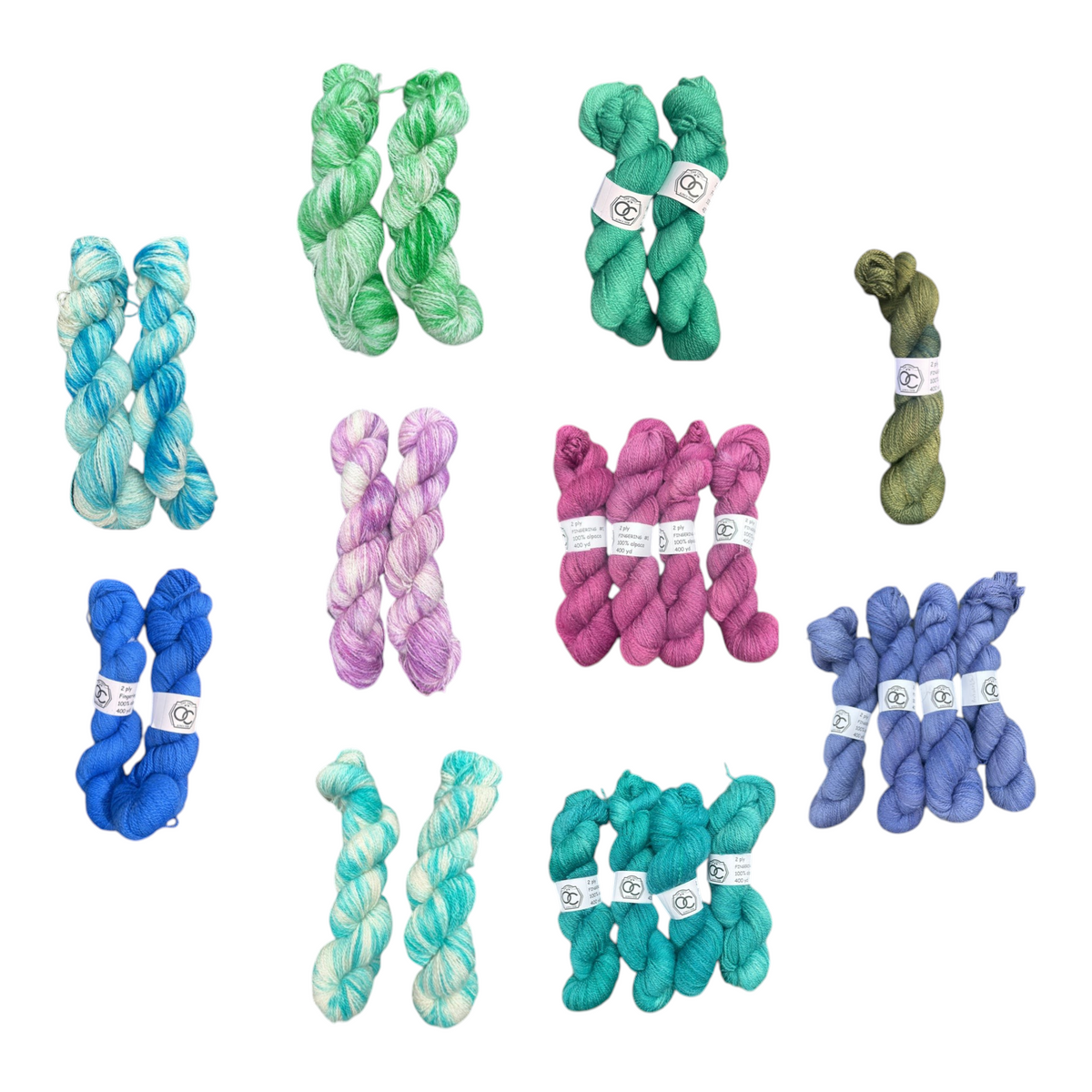 Oak Crest Alpacas and More hand-dyed 100% American alpaca fingering weight yarn skeins in various vibrant colors.
