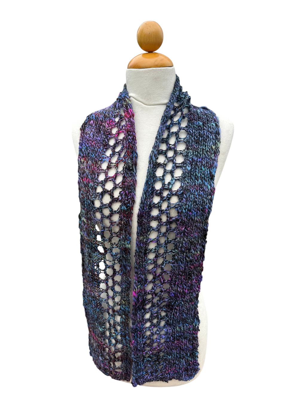 Oak Crest Alpacas and More hand knit alpaca and wool scarf in a multi-colored open weave pattern on a mannequin